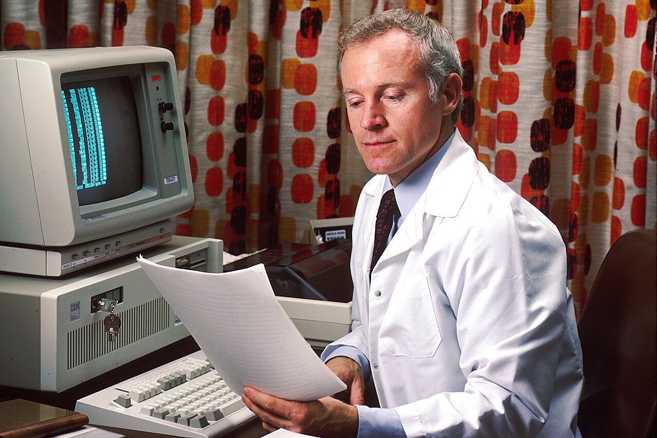 1280px Doctor reviewing pdq